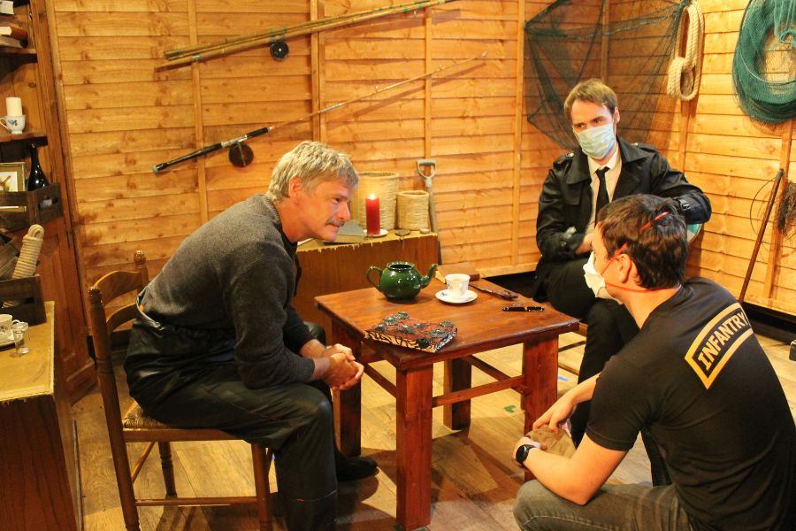 Lachlan on set during the pandemic discussing the scene with the characters