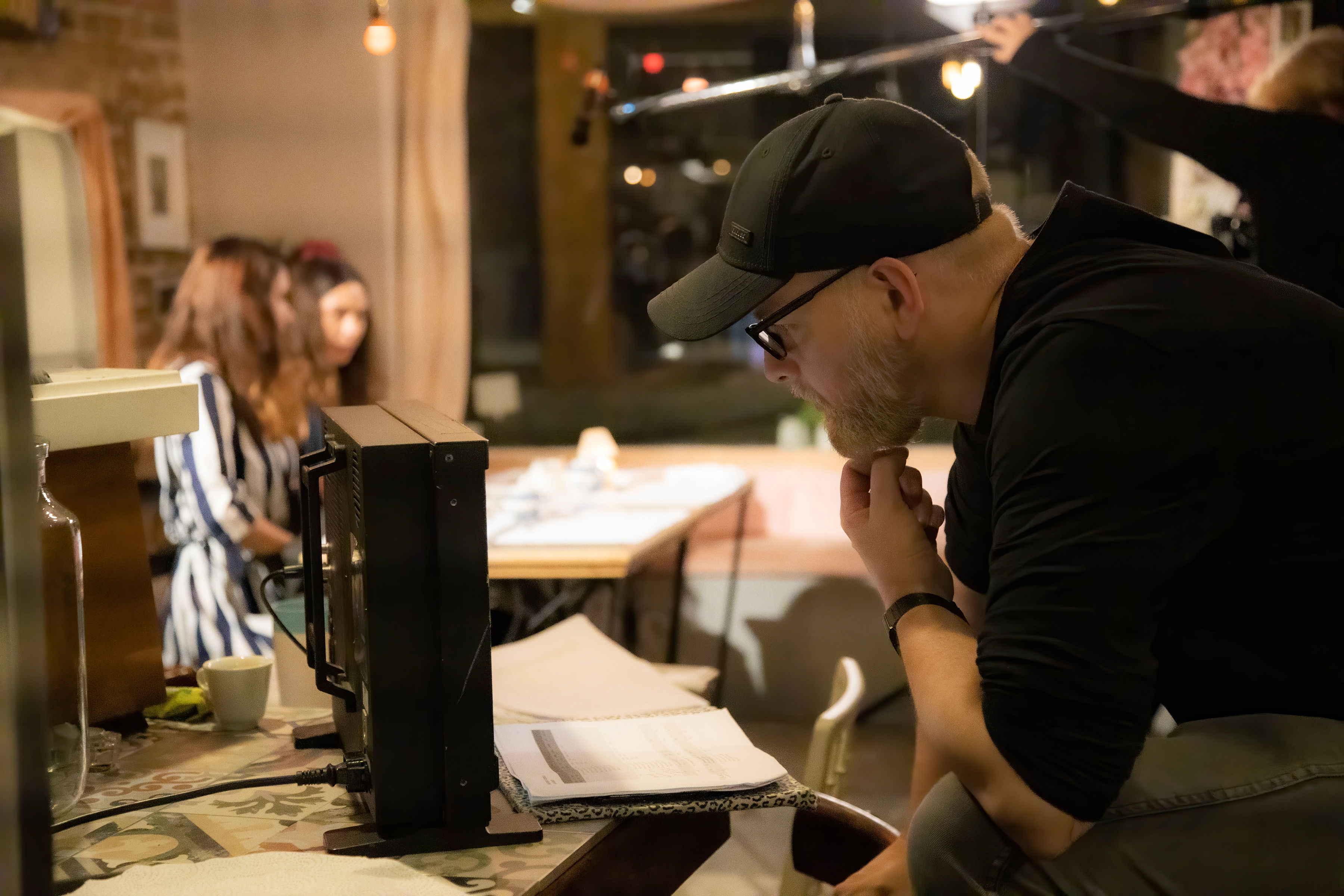 Dan Turner on set looking at screen