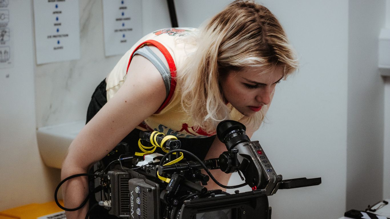 Student holding a camera