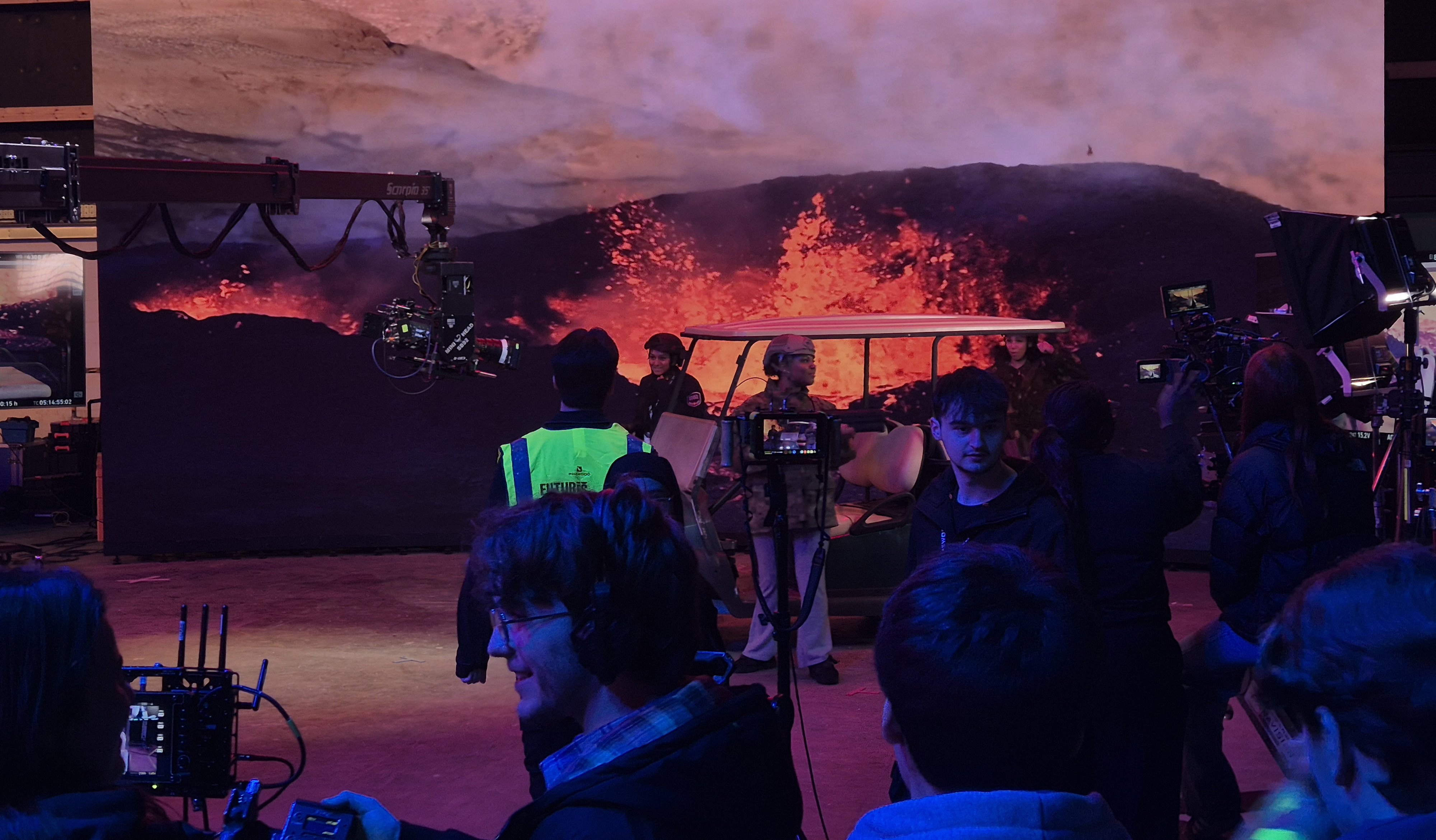 Students looking at giant screen in studio