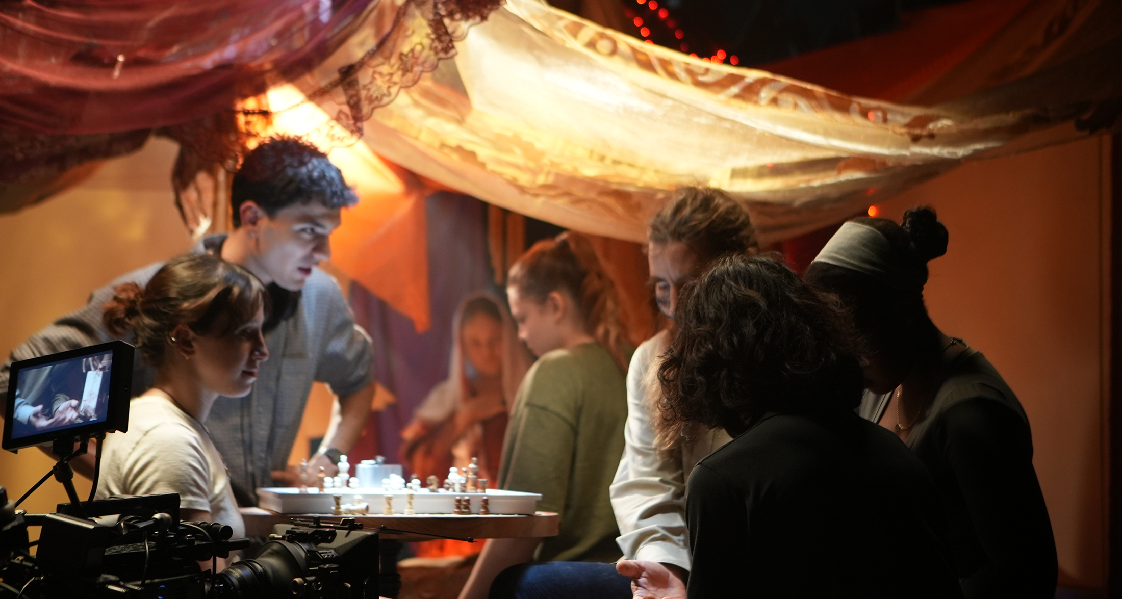 Students on set, collaborating