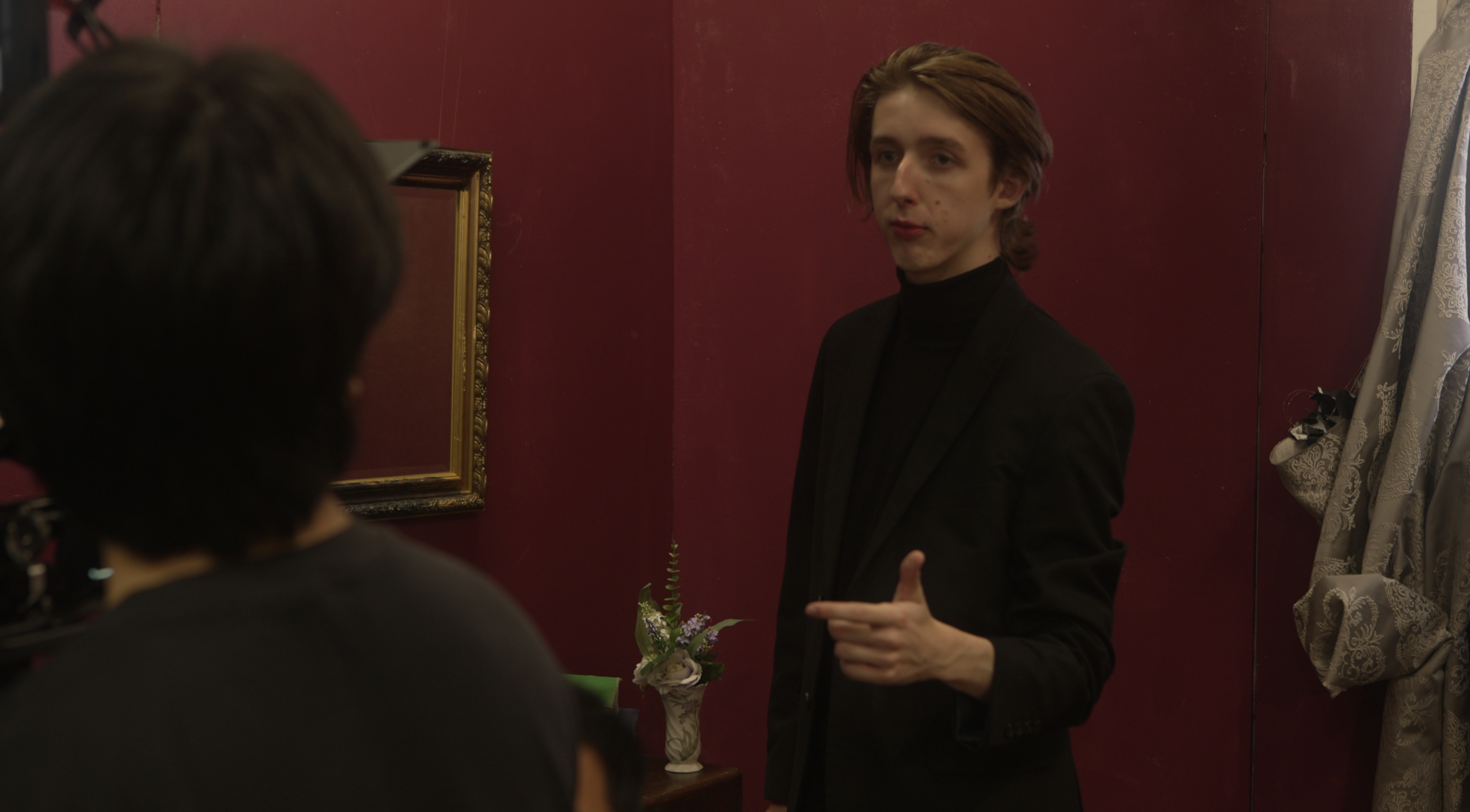 Student filmmaker giving direction on set