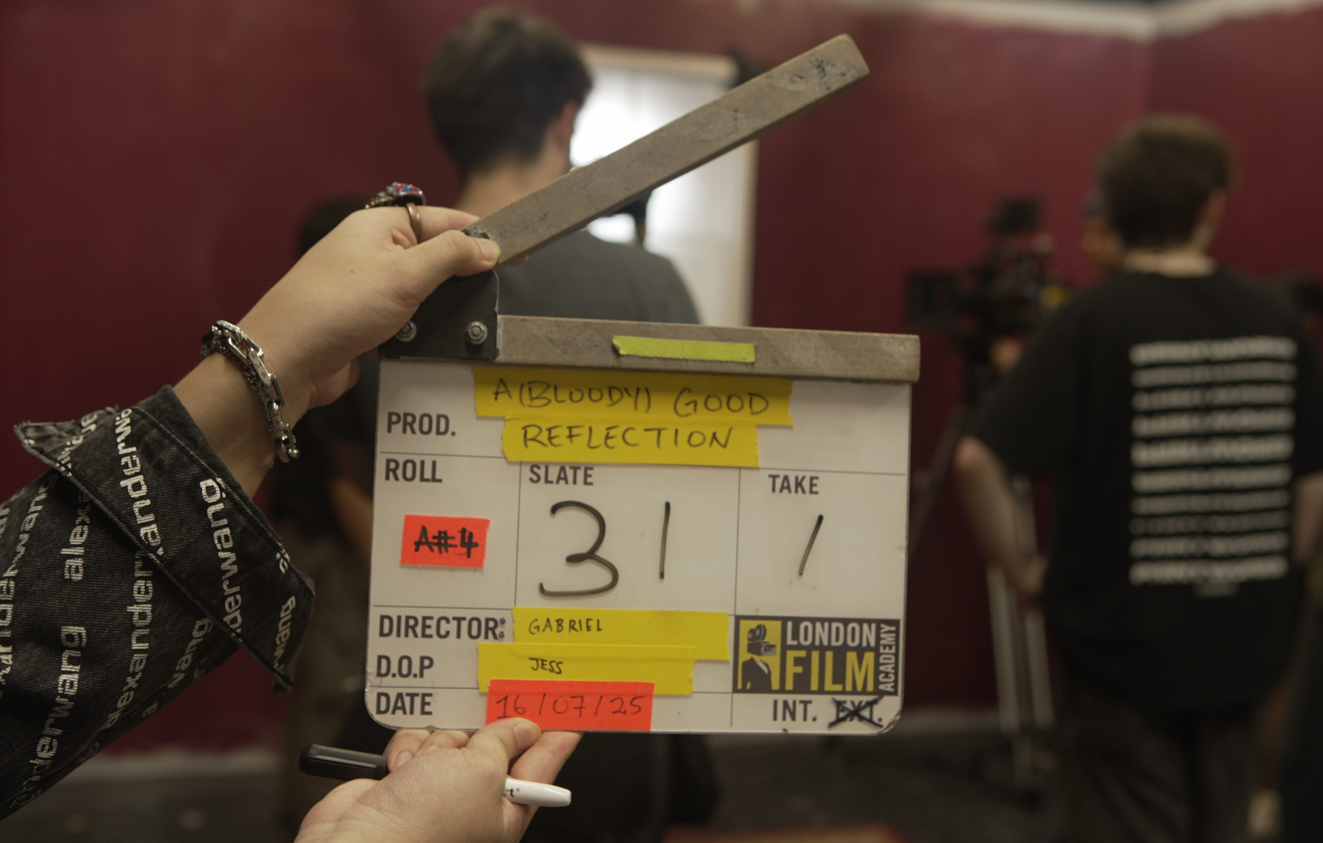 Film clapper board reading 'A (Bloody) Good Reflection'