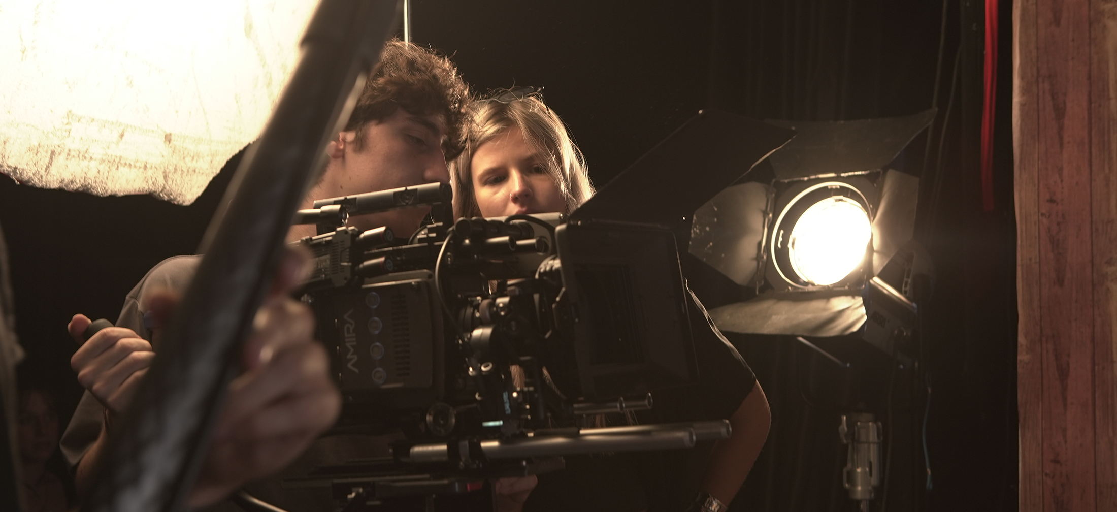 Two students operating ARRI digital camera