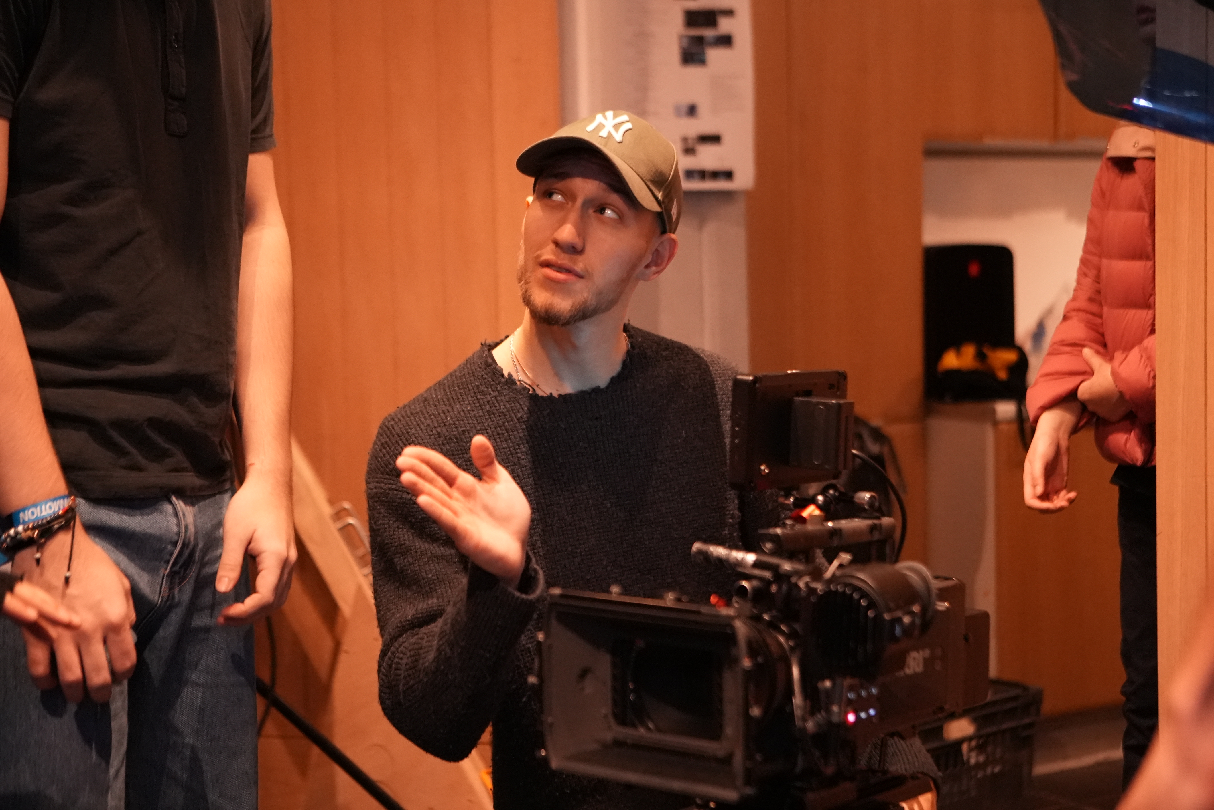 Student pointing at camera