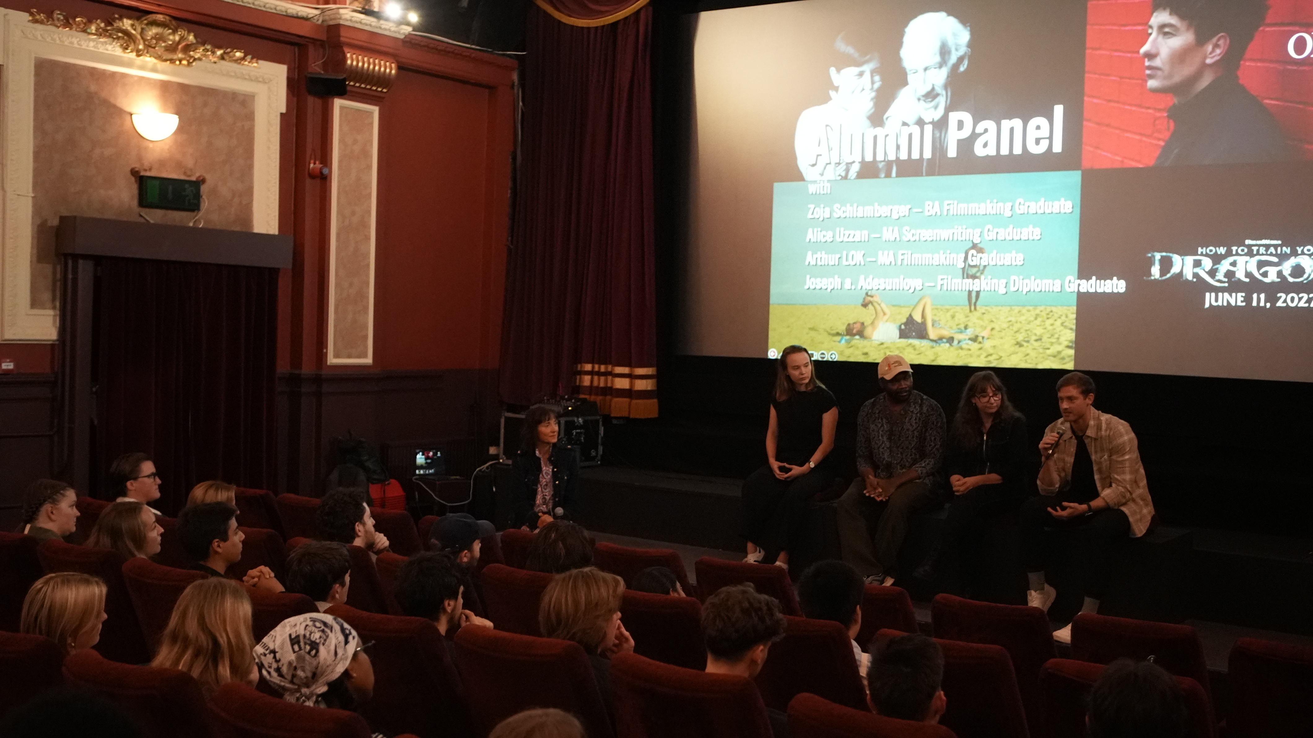 LFA alumni panel talking in front of students in cinema