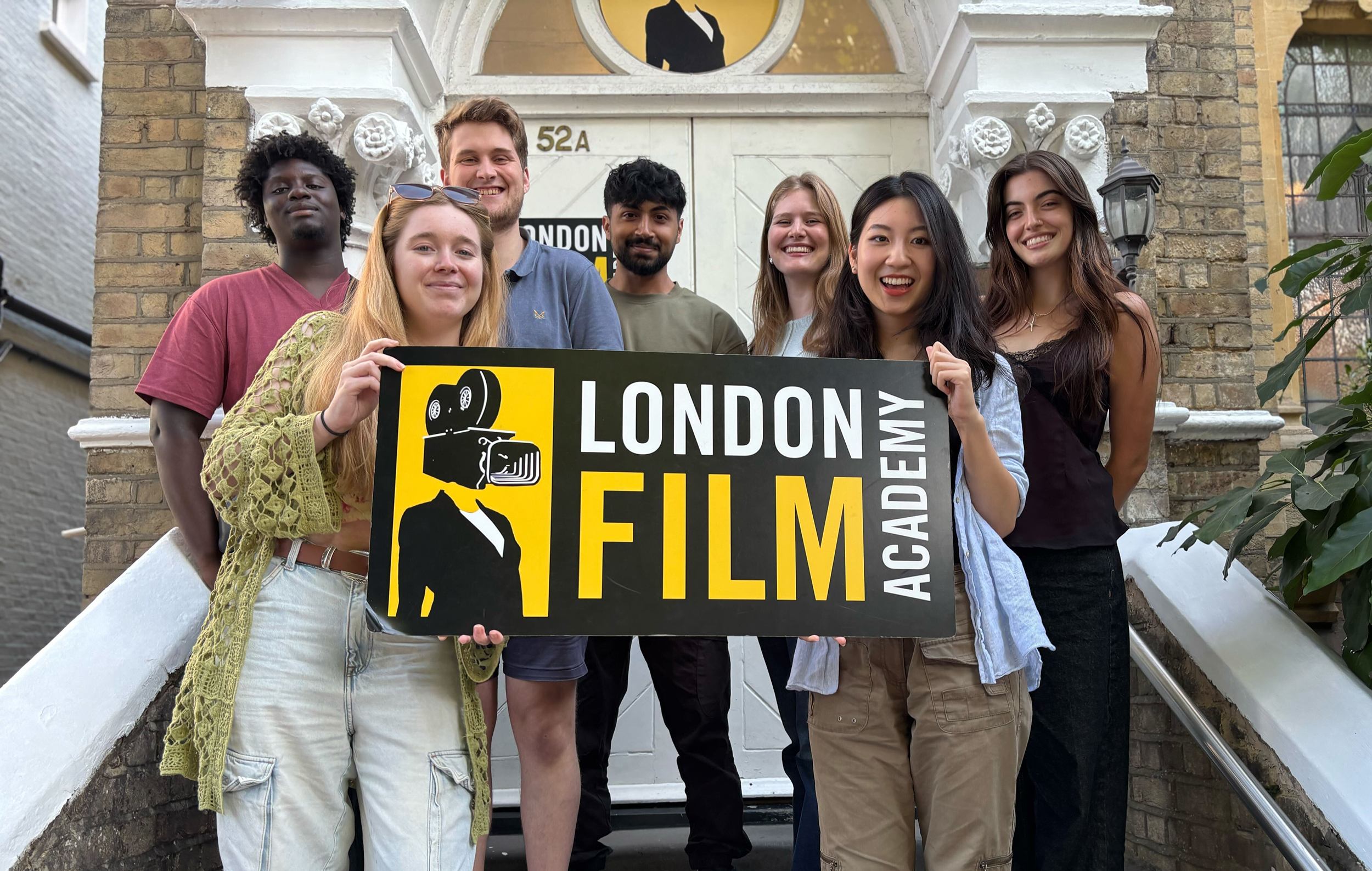 Students standing smiling outside of LFA campus