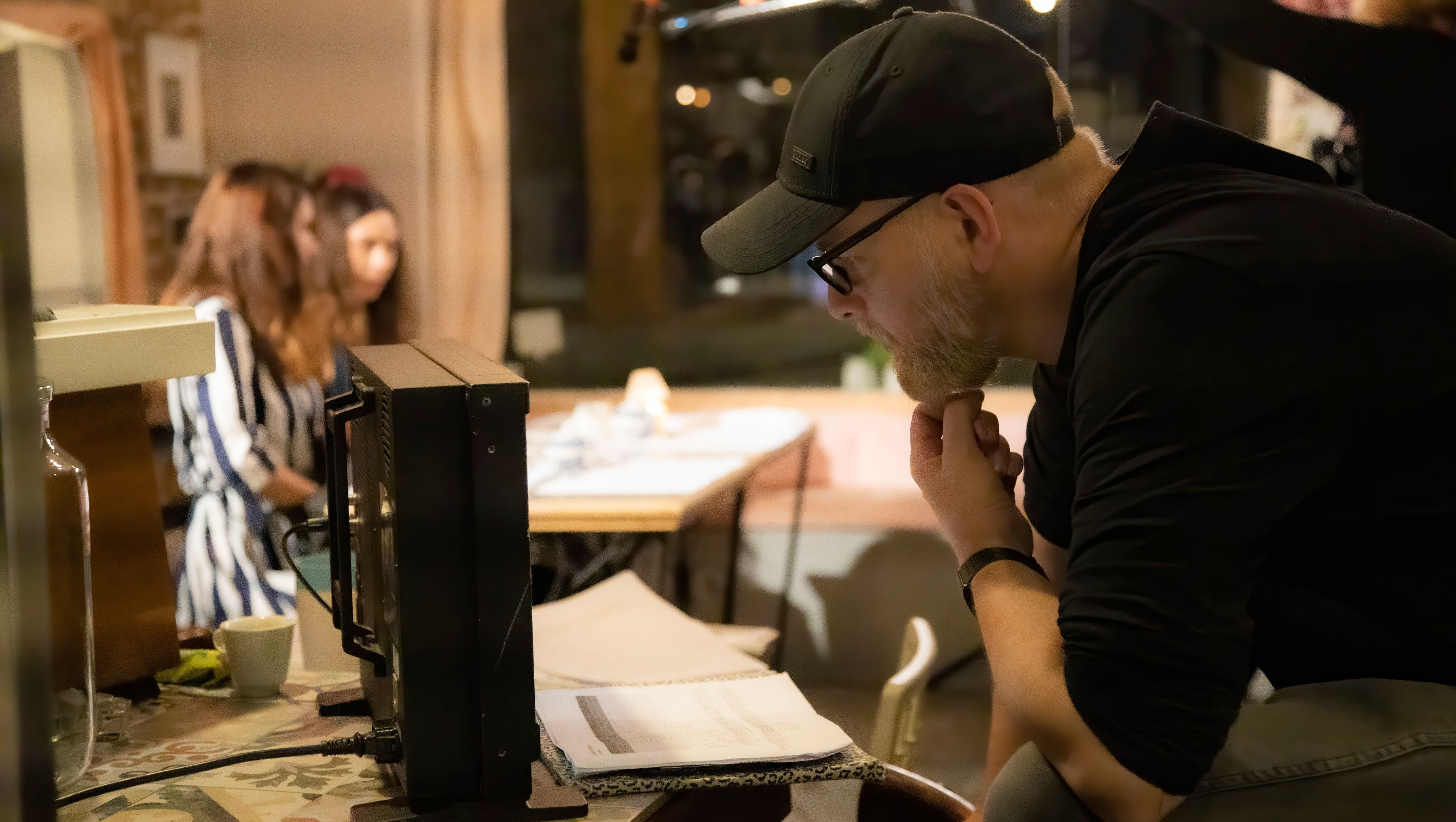 Man staring at digital camera monitor