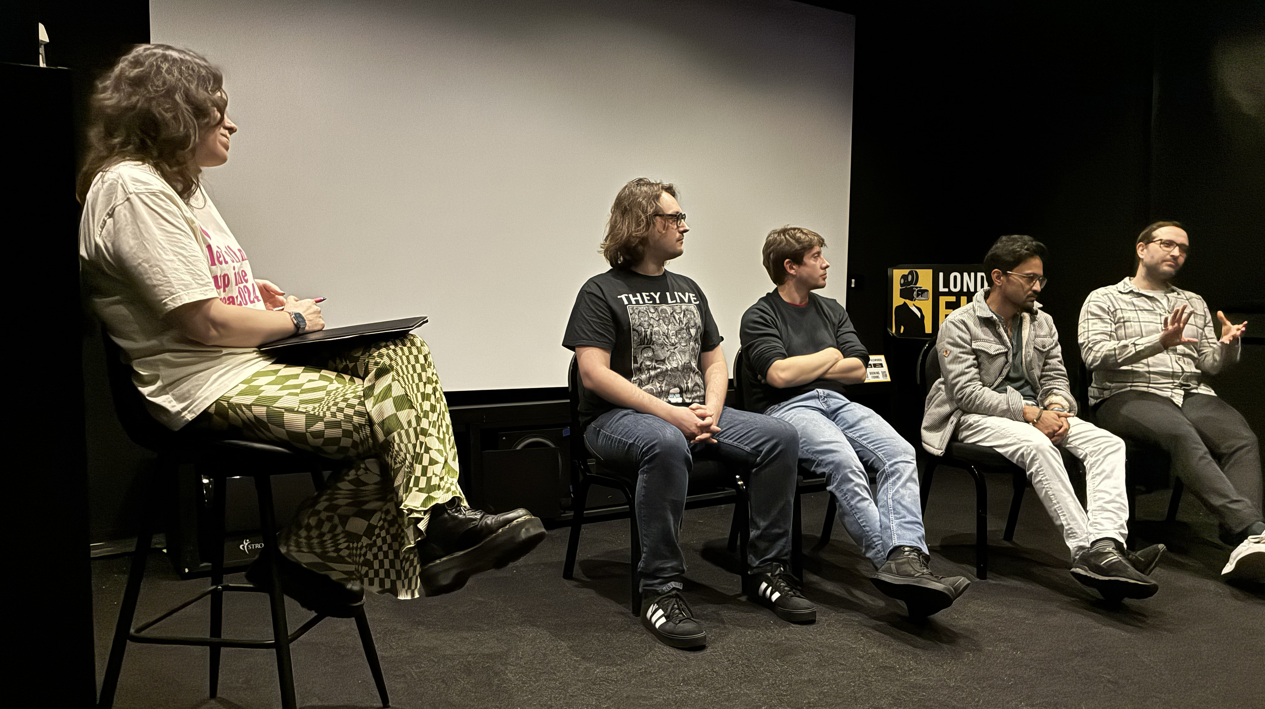Panellists talking to students in cinema