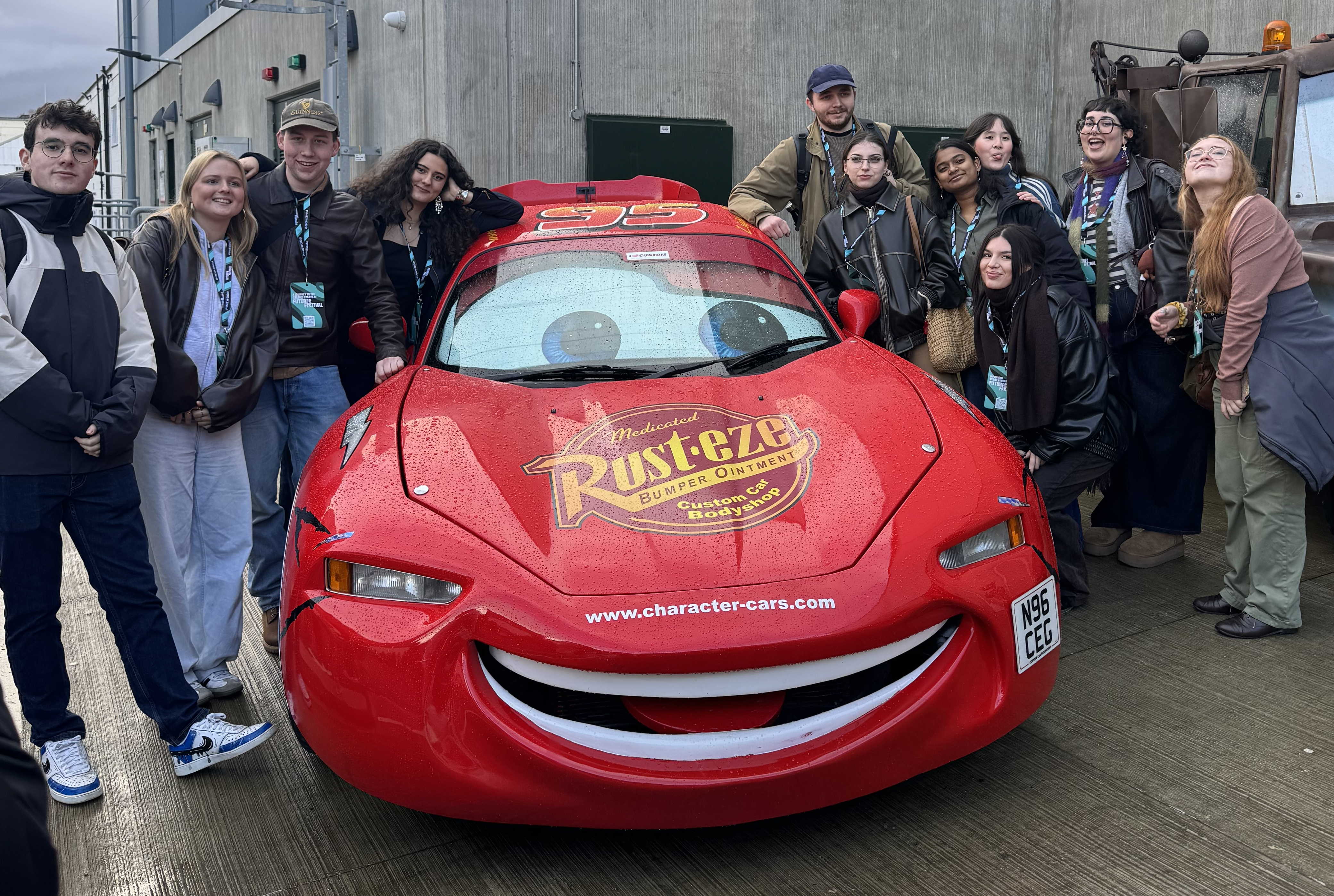 Students stood beside a life-sized Lightning McQueen car replica