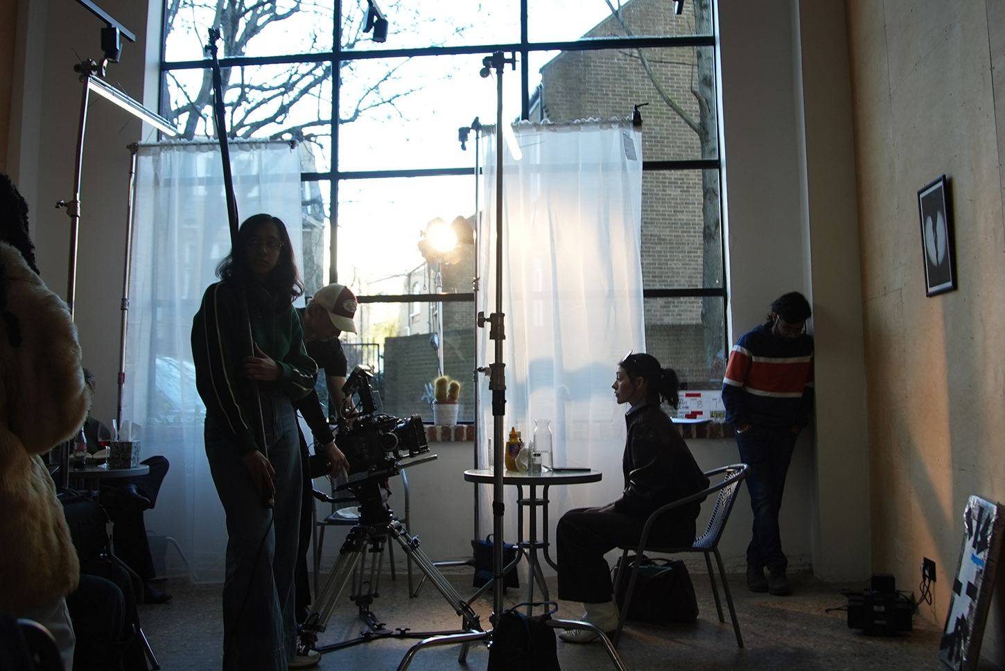 Students getting ready for documentary shoot in bright room 