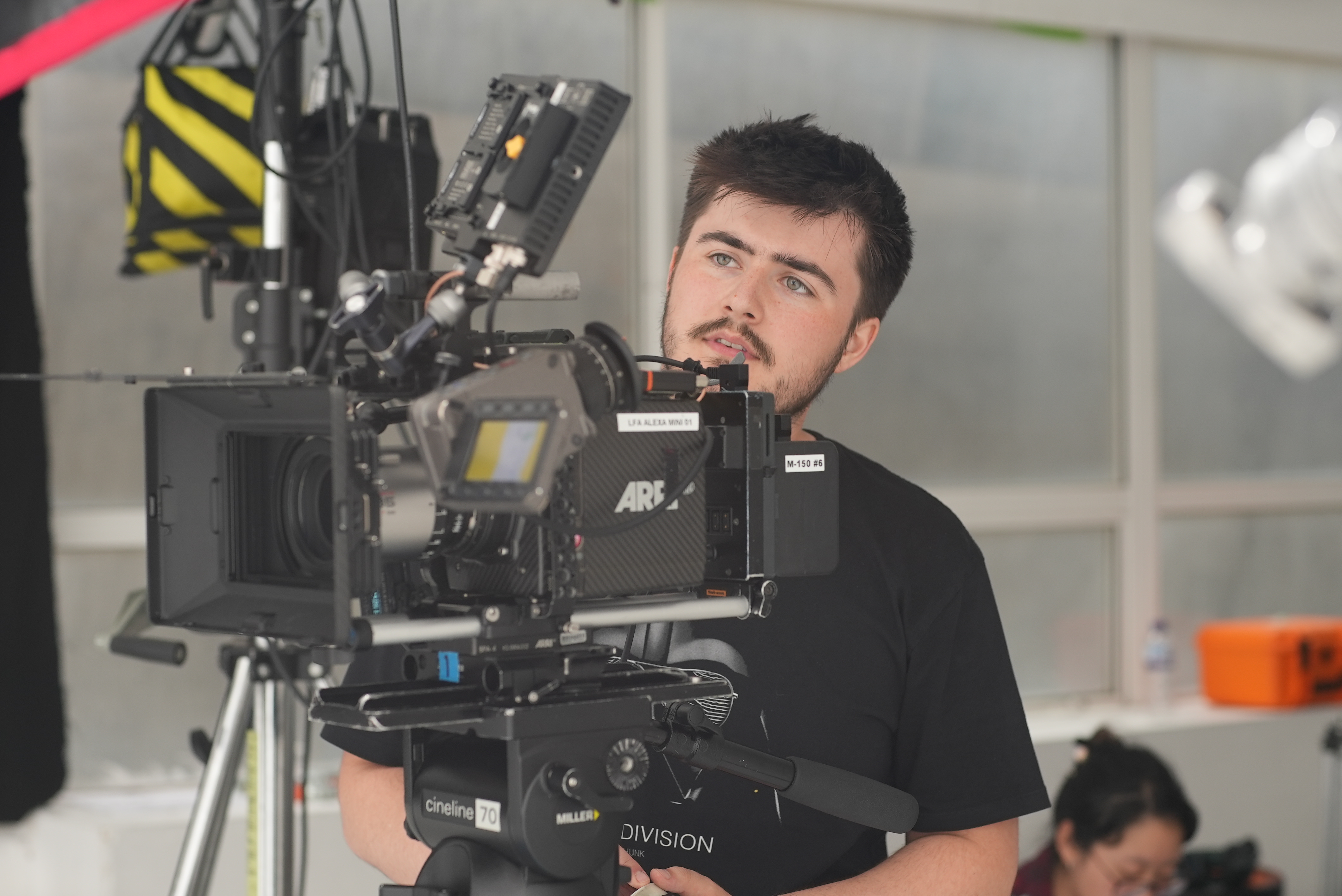 LFA ARRI CAMERA SHORT COURSE - STUDENT LOOKING AT ARRI CAMERA